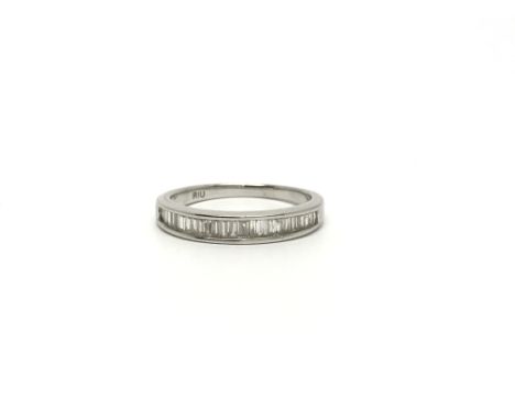 An 18ct white gold half eternity ring set with baguette cut diamonds. Total weight approx 2.9 grams, ring size approx N.