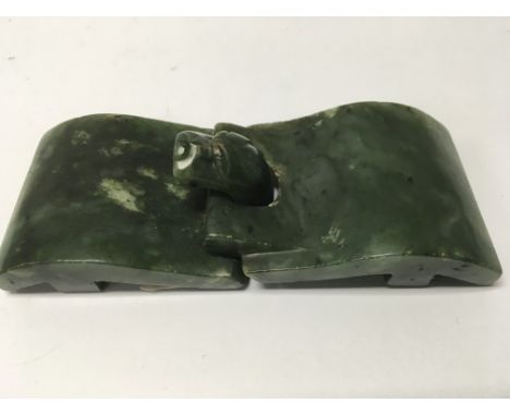 A green jade buckle with serpent style head 10cm by 4 cm with two wax seal marks