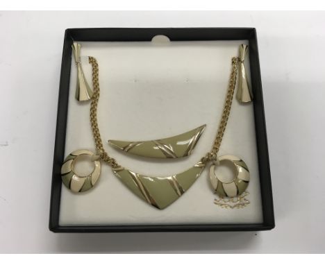 A Jacques Vert set of pale green enamel jewellery to include a necklace, brooch and earrings.