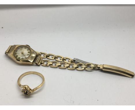A lady's 9ct gold watch on link strap and a cluster ring, approx K