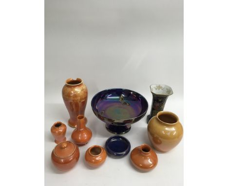 A collection of Pilkington's orange lustreware ceramics plus a Carltonware vase and Devon's footed dish of similar type.Some 