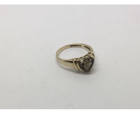 A 9ct gold and smoked quartz ring, approx size I and approx 2.1g.