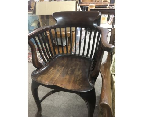 A Victorian desk chair with splat back soild seat on cabriole legs and hoop stretcher