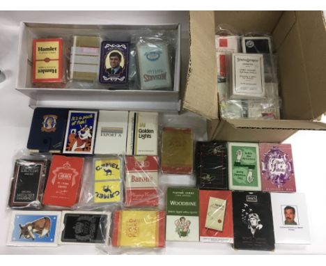 A collection of various playing cards, many sealed.