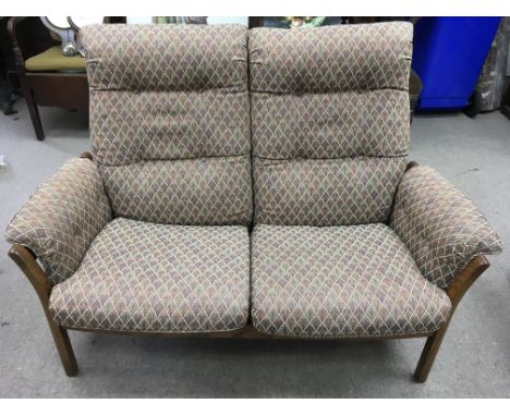 An Ercol two seater sofa with mid brown frame and contemporary patterned upholstery.Approx 132x94x50cm deep.