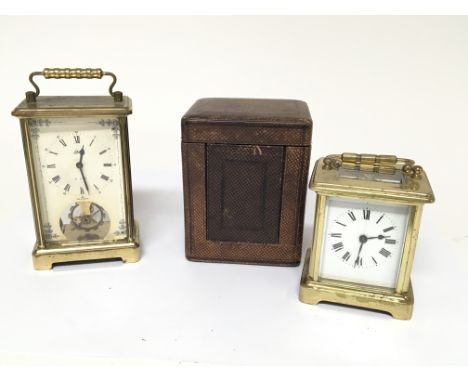 A small French Carriage clock in a fitted case and one other carriage type clock. (2)