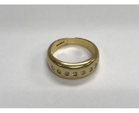 A 18ct gold ring inset with five diamonds size Q 7 .5 grams approx