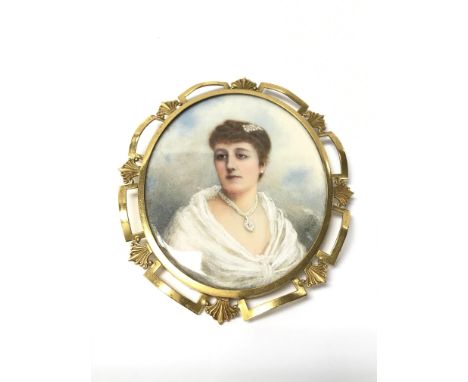 A small oval portrait of a finely dressed lady, signed I E Smith 1902. Approx 10cm x 8.5cm.