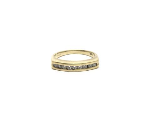 A 14ct gold ring set with a band of CZs, ring size approx O, total weight approx 3.5 grams.