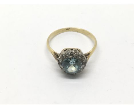 A vintage aquamarine and chip diamond ring, approx size L and approx 2.5g.