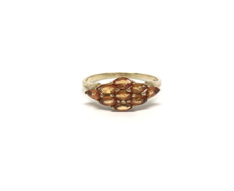 A 9ct gold ring set with yellow sapphires, ring size approx S, total weight approx 2.1 grams.