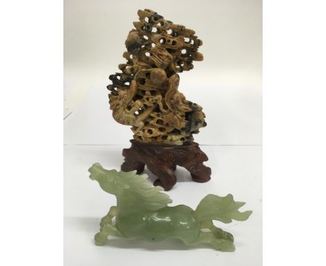 A Chinese jade horse, a/f, and a soapstone carving.