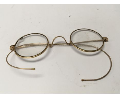 A pair of vintage spectacles possible gold rims.