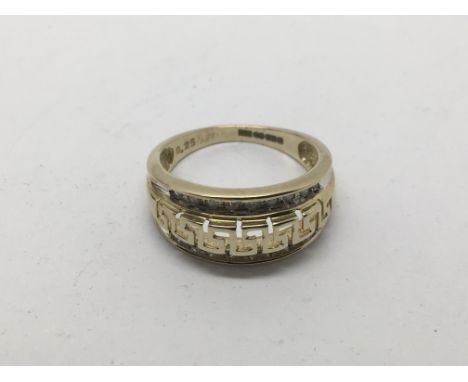 A 9ct gold ring with Grek key pattern and set with small diamonds, approx total .25ct, approx size N and approx 3.3g.