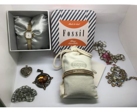 A boxed Fossil bangle watch, a lady's Rotary example and costume jewellery odds