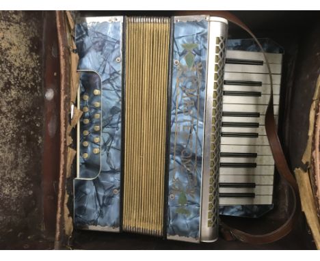 A cased Mastertone accordion.