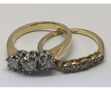 An 18ct gold three stone diamond ring with a 1/2ct five stone diamond ring. Size K-M