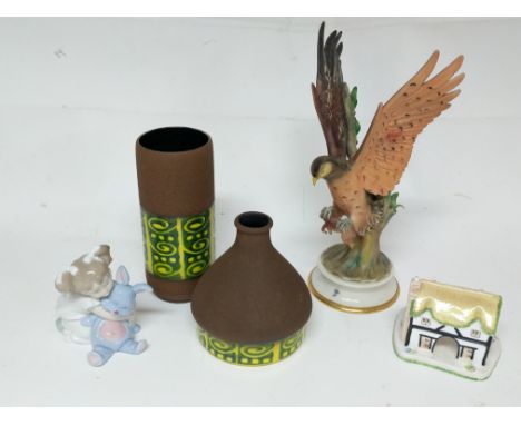 A Capodimonte bird ornament, two German art pottery vases, a Nao figure of a girl plus a Coalport cottage (5).