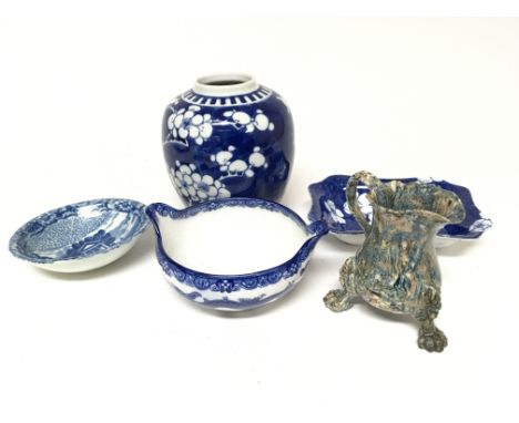 An interesting early 19th century or 18th Century English ceramic jug with lion mask and pad feet. Doulton blue and white dis