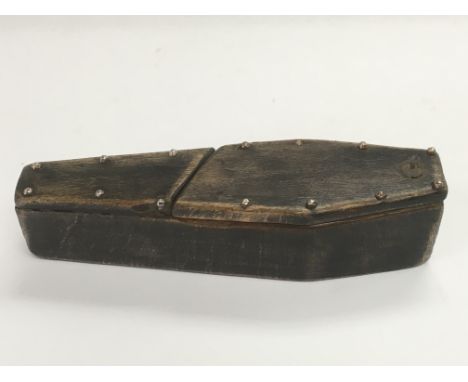 A coffin shaped snuff box with engraved skeleton to base, approx 11cm in length.