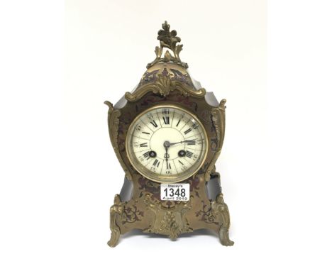 A Quality late 19th Century French Boulle mantel clock with an enamel dial with both roman and Arabic numerals. The movement 