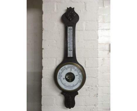 An oak wall barometer.