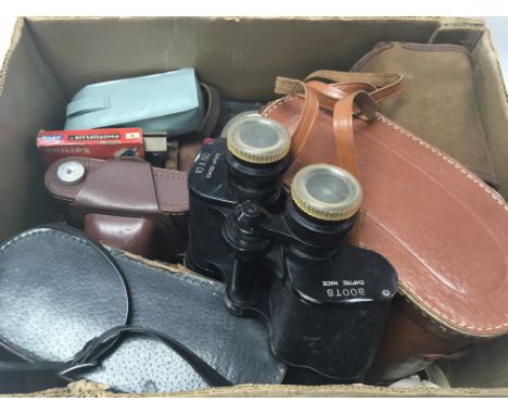 A box containing vintage cameras and cased binoculars and acamera case containing a Praktica B100 camera