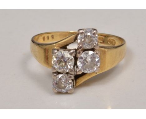 18ct gold four stone diamond ring, off centre setting.