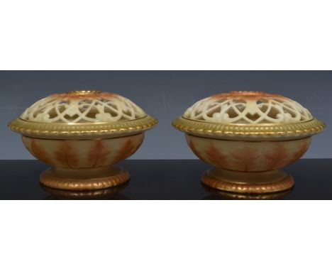 Pair of Royal Worcester pot pourri vase, circa 1900, reticulated domes, no. 302/G, diameter 10.5cm.