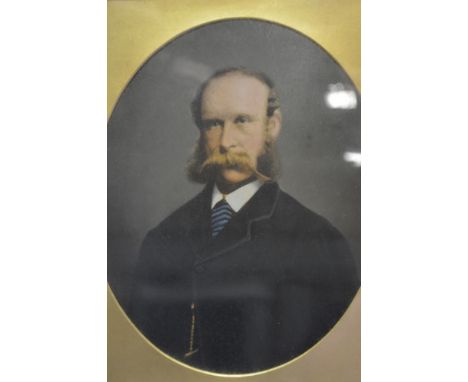 Victorian over painted photograph, Portrait of a Gentleman, oval in a gilt frame within a rosewood frame, 50cm x 44cm overall