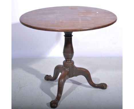 Georgian mahogany pedestal table, circular top, baluster column on tripod legs, with ball and claw feet, diameter 83cm.