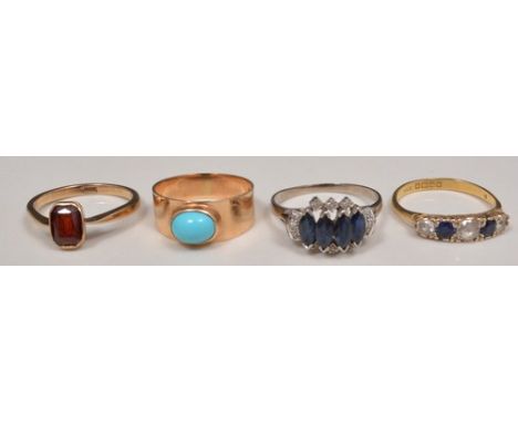 14ct rose gold turquoise set ring, stamped .585, garnet set ring and two other dress rings set with blue and white stones.