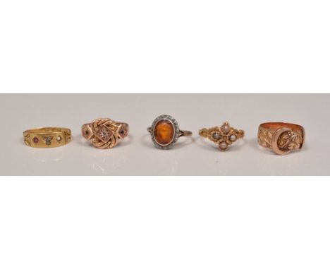 9ct rose gold buckle ring, a 9ct knot ring, Victorian 18ct dress ring (sapphire missing) and two other dress rings.