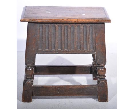 Oak box seat stool, deep nulled frieze, width 46cm.