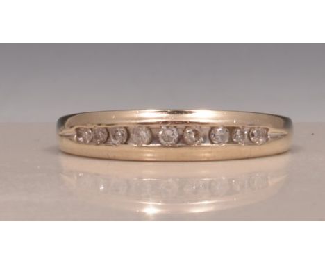 14k white gold half eternity ring, with channel set diamonds.