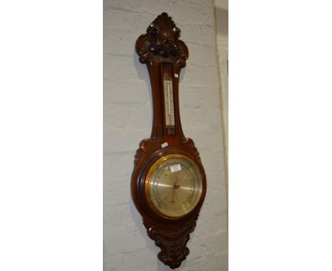 Stained walnut aneroid banjo shape barometer, carved decoration, replaced thermometer, 93cm.