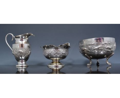 Indian/Burmese silver circular basin, Repousee band with elephants, lions and other animals on three lion paw feet, diameter 