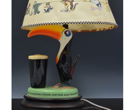Advertising:  "How Grand to be a Toucan, just think what Toucan do", a lamp base for Guinness with original shade, 45cm overa