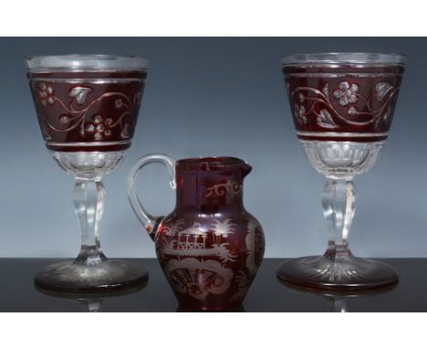 Pair of ruby overlaid goblets, hexagonal tapering stems, 16cm, a ruby overlaid jug and pedestal bowl, wheel engraved decorati