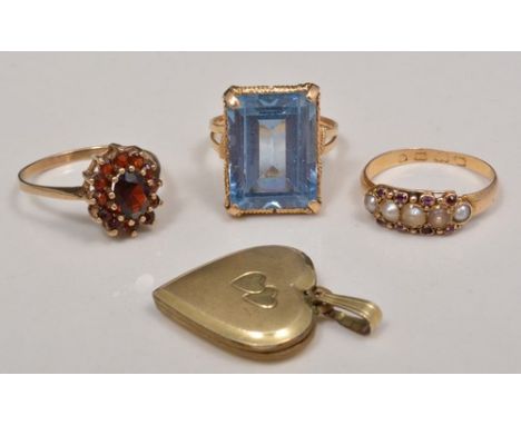 18ct gold dress ring, set with a blue topaz (?), a garnet cluster ring, a pearl set dress ring and a gold fronted heart shape