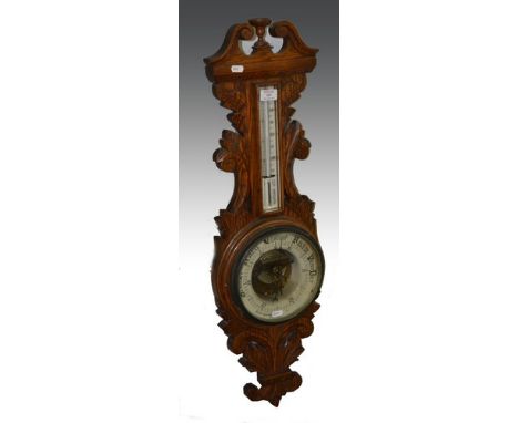 Victorian carved oak aneroid wall barometer, ceramic chart signed Curtis & Horspool, Leicester, 90cm.