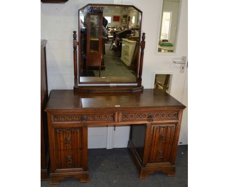 Oak three piece bedroom suite, labelled Crown Furniture, carved decoration comprising a twin pedestal dressing table with a m