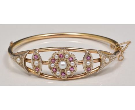 Edwardian 15ct half hinged bangle, set with rubies and pearls.