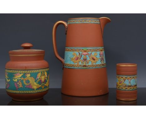 A Pratt Ware Terracotta tapering jug,  with Renaissance style enamel band, 21cm and five other items of Terracotta ware with 