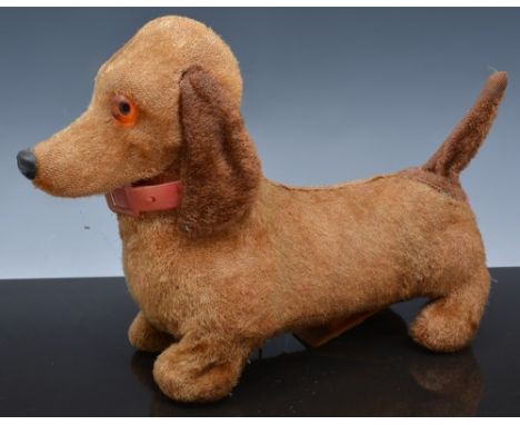 Three gold plush pull along puppies, including a battery operated Dachshund, together with a Bakelite View Master Junior proj