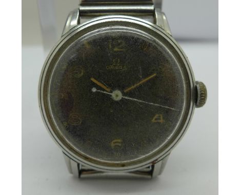 A nickel and stainless steel Omega manual wind wristwatch, black dial, 15 jewels, not working. Case diameter 32mm