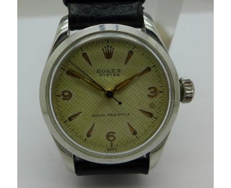 A stainless steel Rolex Oyster shock-resisting manual wind wristwatch, 15 rubis, 15067, fitted with leather strap, working. C