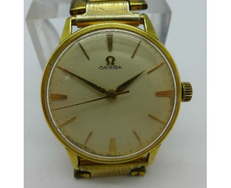 An 18ct gold cased Omega manual wind wristwatch, 285 calibre, 17 jewels, working. Case diameter 34mm