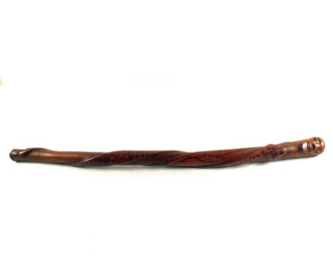 A heavy Tribal wooden carved stick with head top with snake climbing, length 35"
