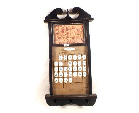 A wooden wall calendar plus detachable enamel numbers